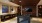 a clubhouse room with a pool table and a tv on the wall