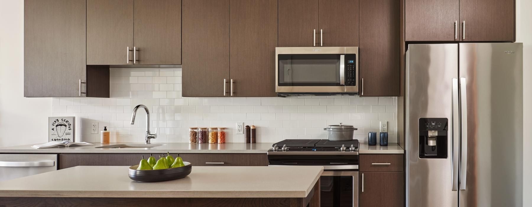 a kitchen with wooden cabinets