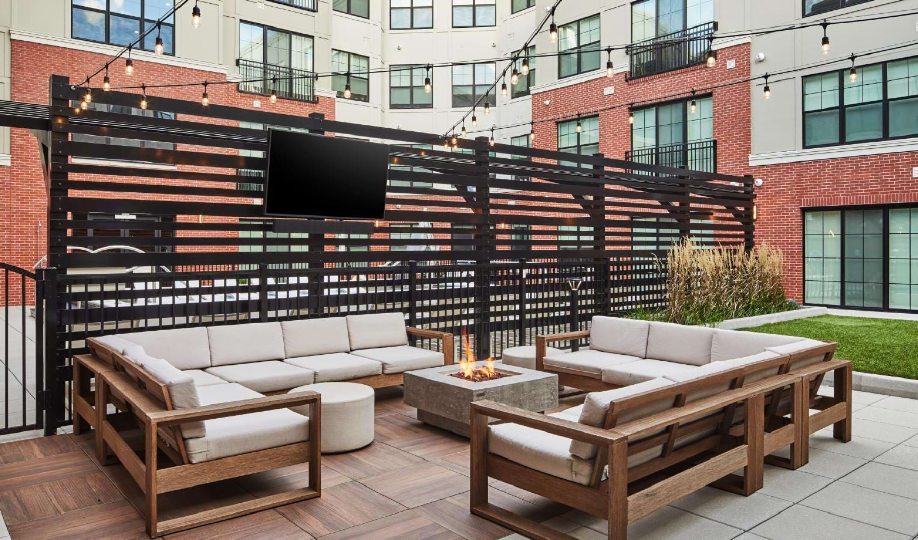 a deck with a tv and chairs
