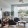 a living room with a couch, chairs and a tv