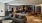 a clubhouse room with a large tv and a couch