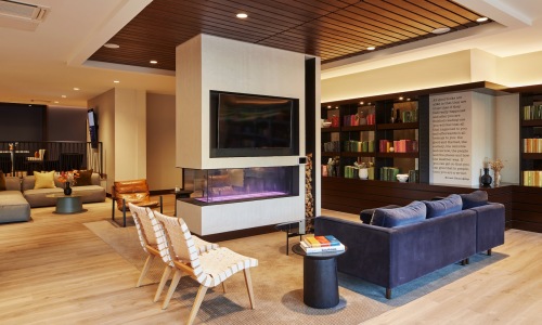 a clubhouse room with a tv and a couch