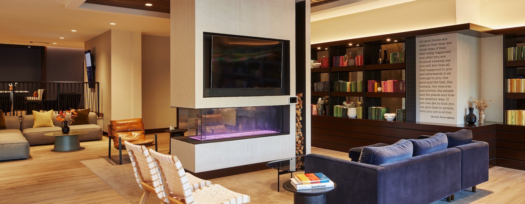 a clubhouse room with a tv and a couch