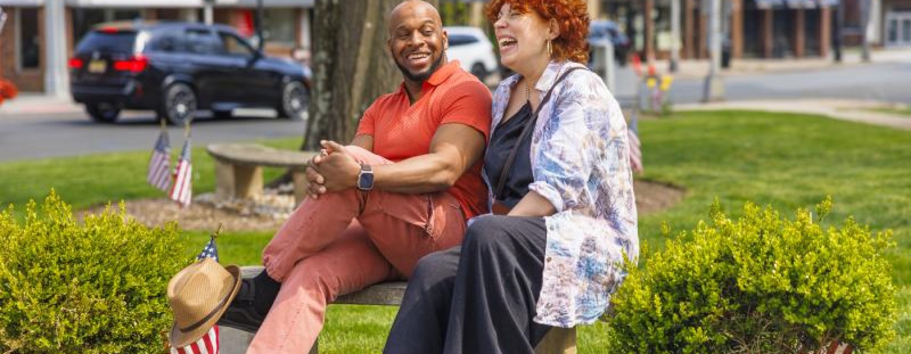 a man and woman sitting on a bench