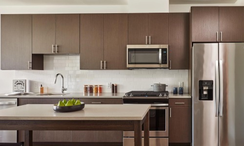 a kitchen with wooden cabinets
