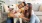 a man and woman holding a dog