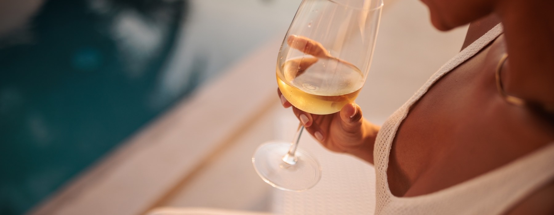 a person holding a glass of wine