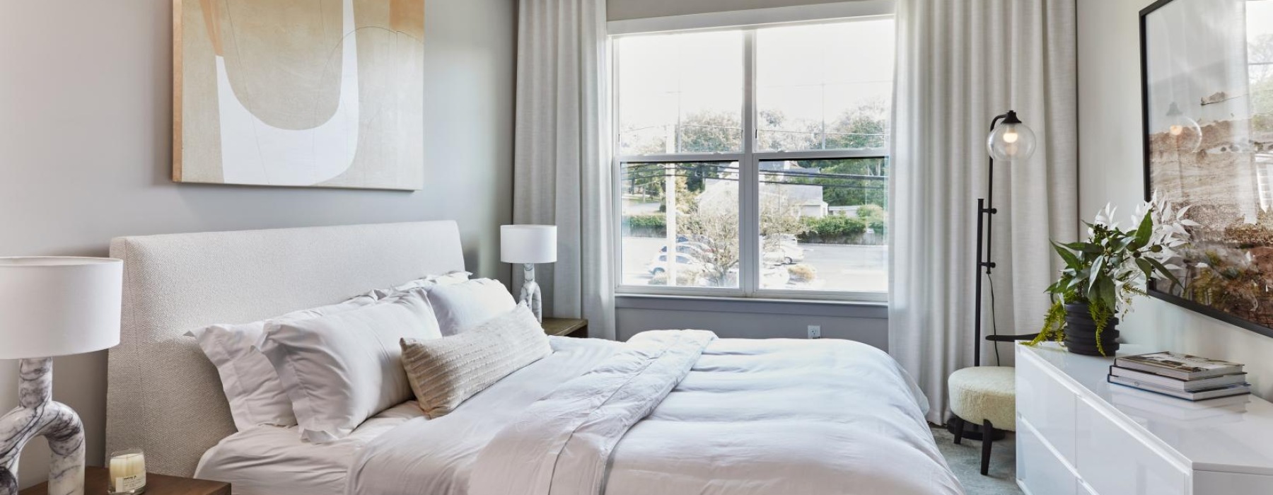 a bedroom with a large window